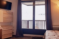 Val Thorens | Les Cimes De Caron - CC2604 -  slaapkamer met balkon en tv